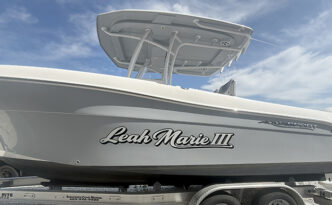 Leah Marie boat lettering in Beach Haven West, New Jersey after removal of the previous name and installation of new marine-grade vinyl graphics